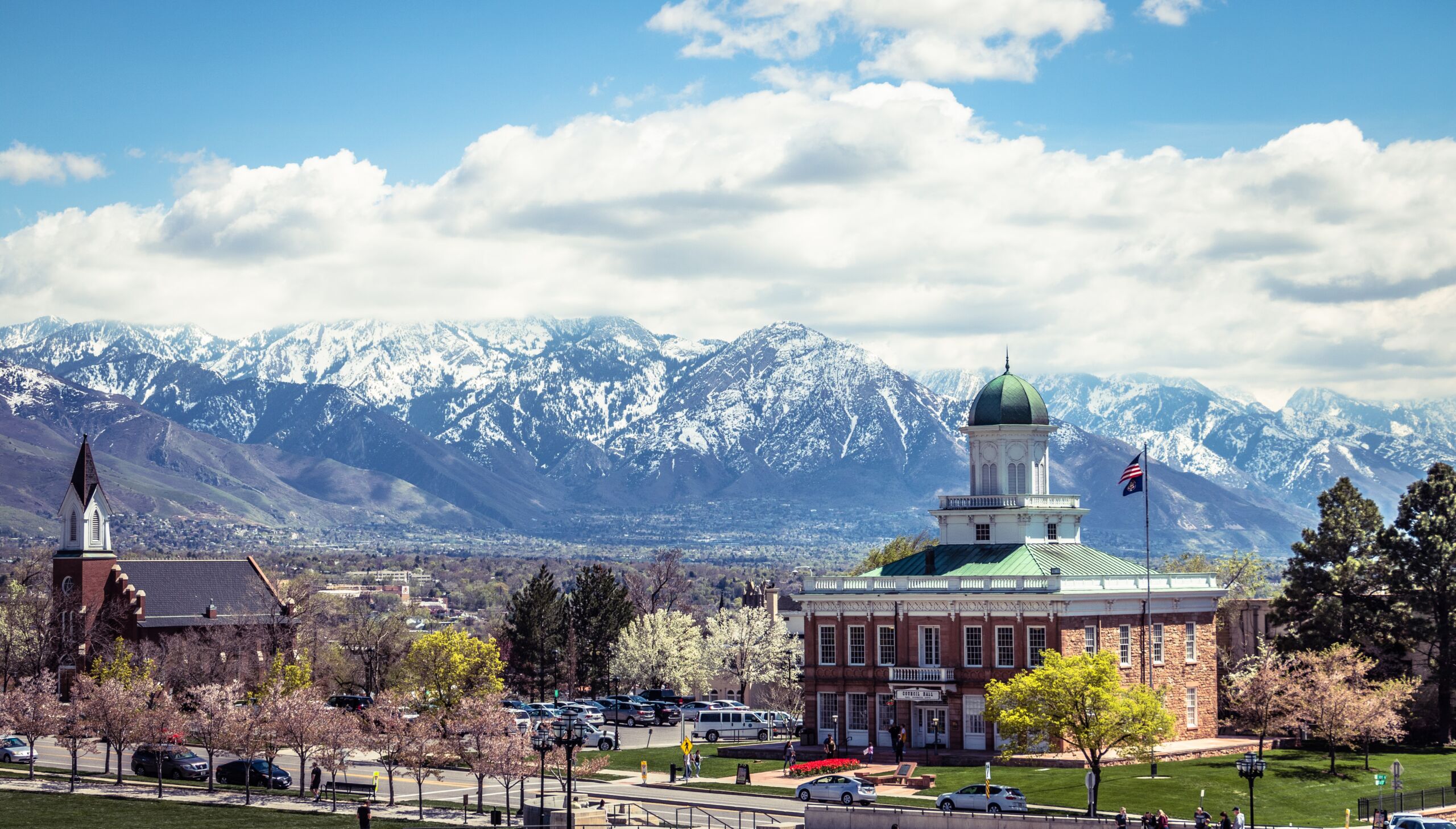 A view of mountains and buildings in the background.